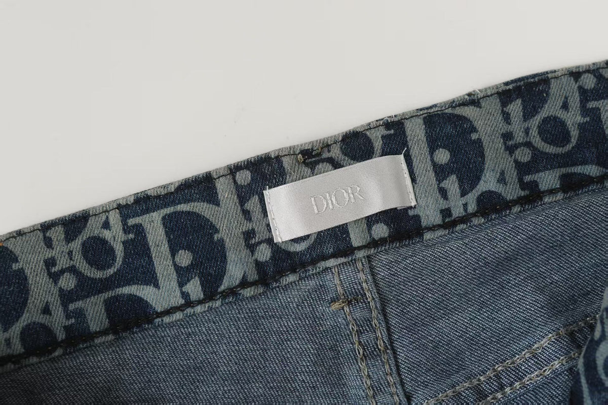 Oblique All-Over Print Faded Denim Jeans | Blue